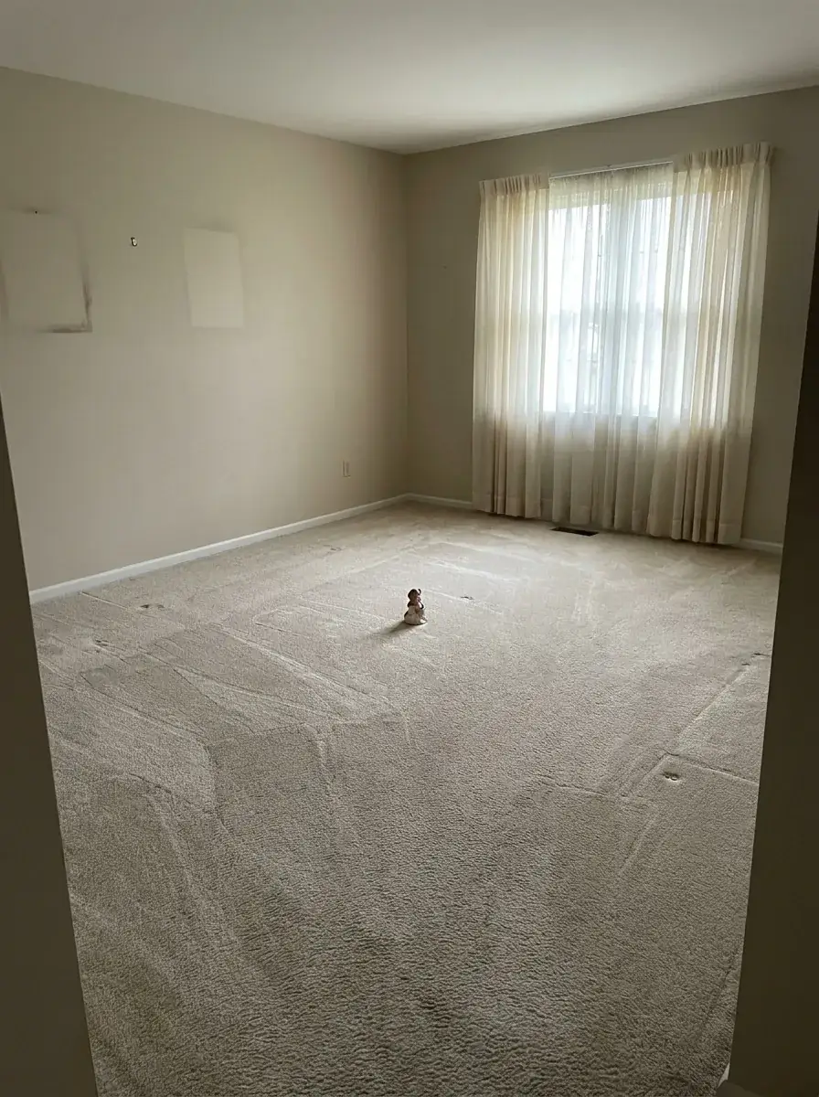 Same living room emptied and swept after estate cleanout